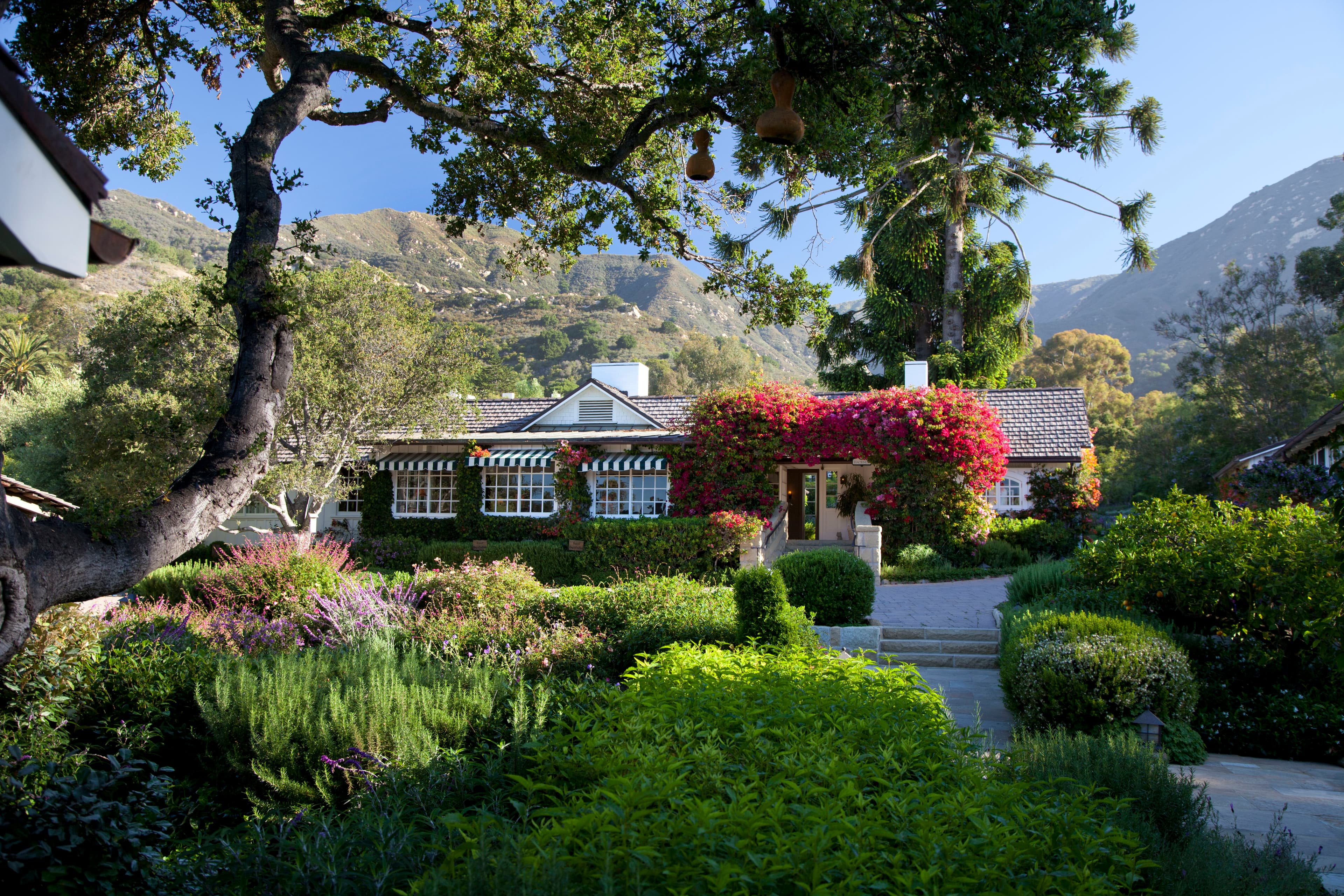 San Ysidro Ranch hacienda building framed by garden walls in Montecito